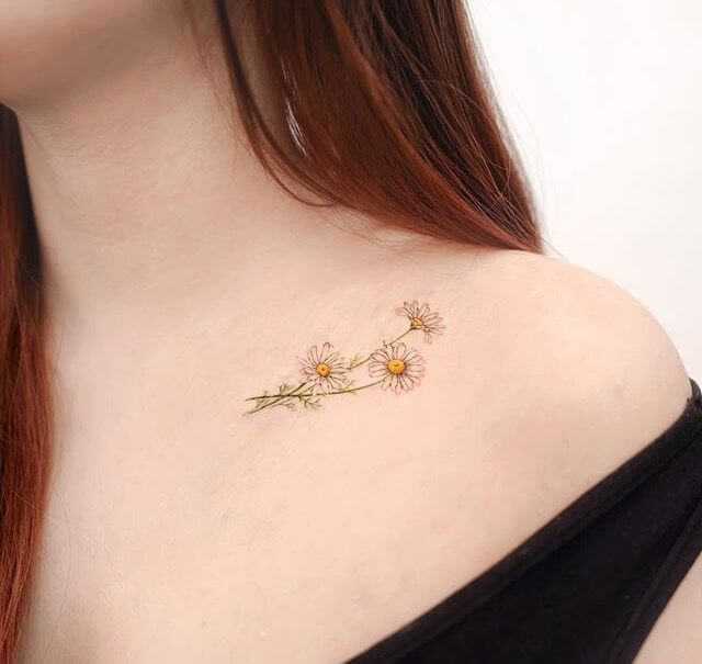 minimalist daisy flowers april month flower tattoo design idea on collarbone for females