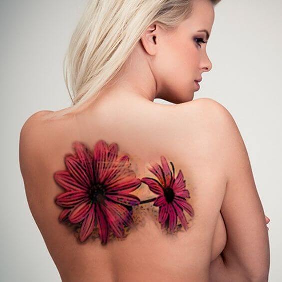 beautiful pink gerbera daisy flower tattoos on back for women