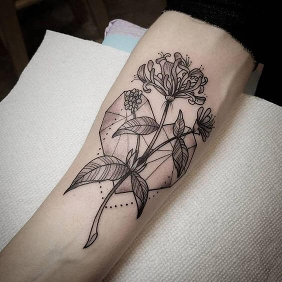 geometric heart with honeysuckle june birth flower tattoo design idea for females
