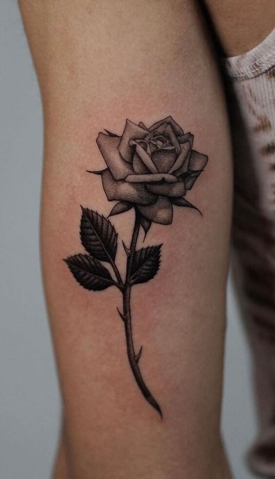 grey rose june birth flower tattoo design idea on upper arm for females