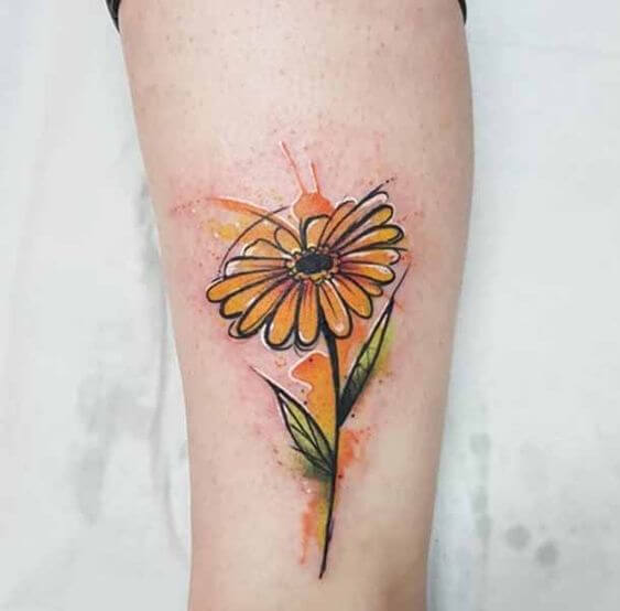 watercolor yellow gerbera daisy flower tattoo design idea for girls