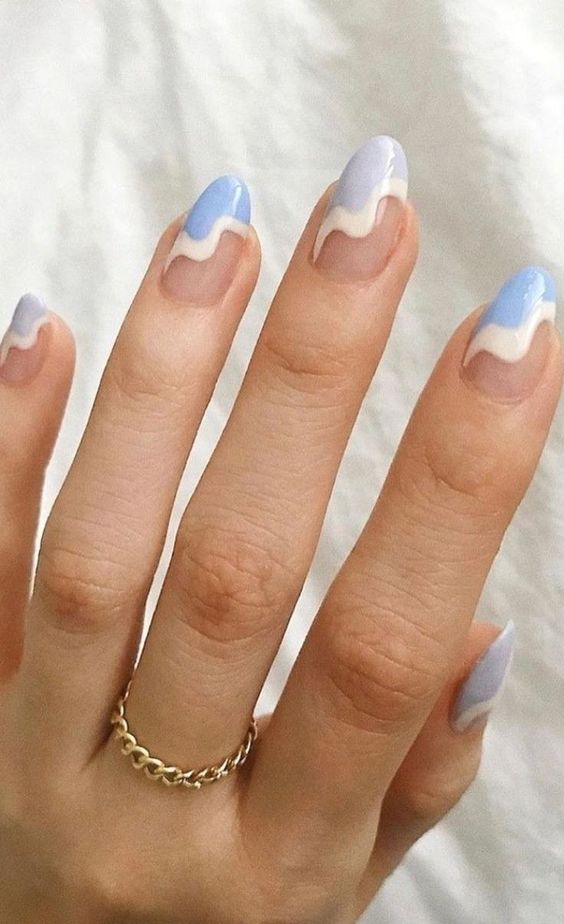 blue with white swirls oval shape manicure idea for 2022