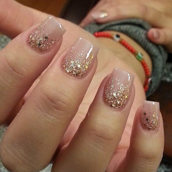 confetti with golden glitter and on nude nails art designs idea for 2022