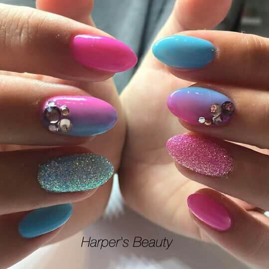 cotton candy colored with hues of pinks and blues with rhinestone oval nail art designs idea for 2022