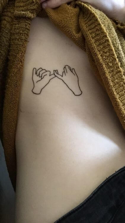 pinky promise small meaningful tattoo design idea on side ribs for women