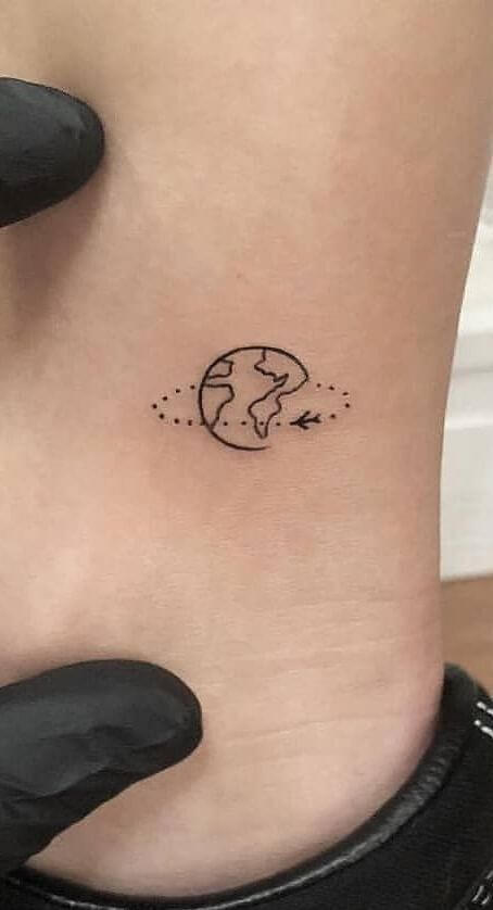 traveling around the world small meaningful tattoo design idea
