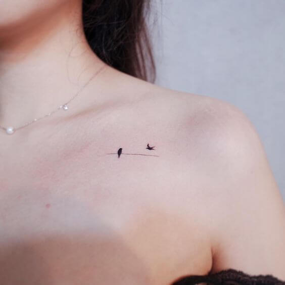 birds on a wire small meaningful tattoo design idea on collarbone for females
