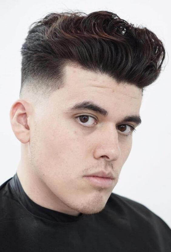 men wavy top with tapered faded sides haircut for short hair