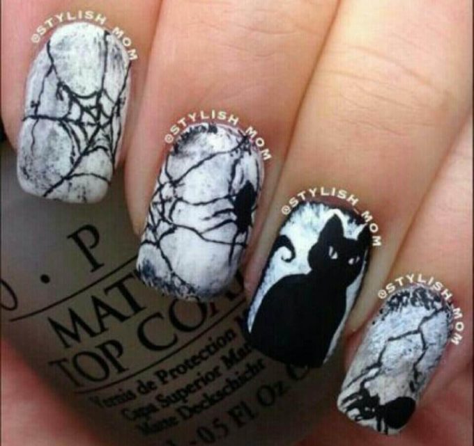 magical black cat inspired witch nail art design idea