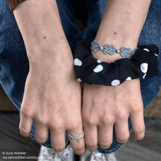minimal one dot tattoos ideas on back wrist for females