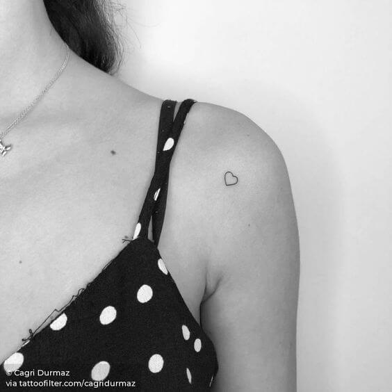 cute minimal heart tattoo design idea on shoulder for females