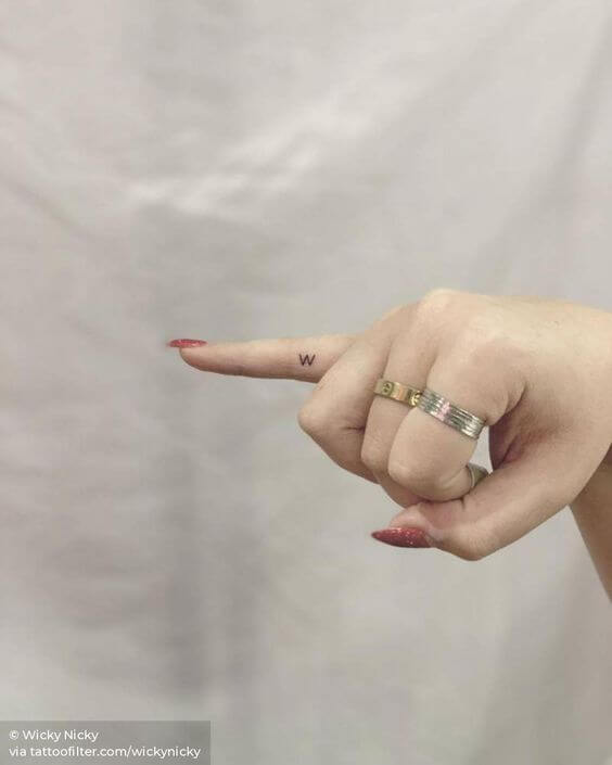 minimal initial tattoo idea on side little finger for females