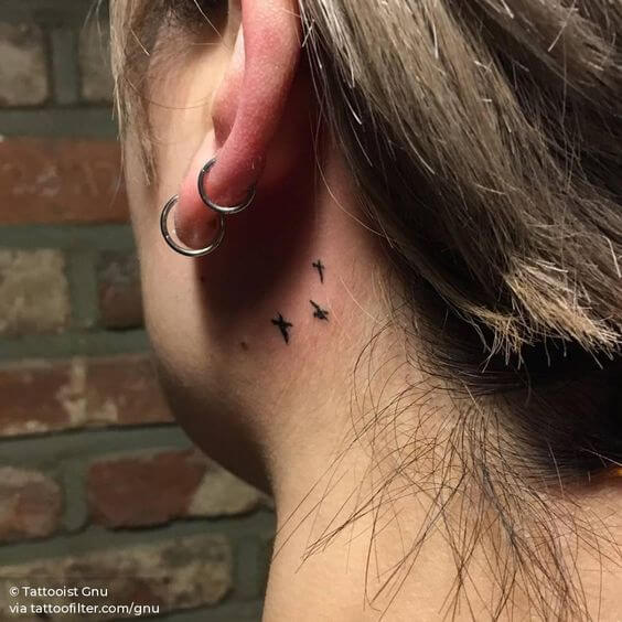 minimal bird tattoos designs idea behind ear for females