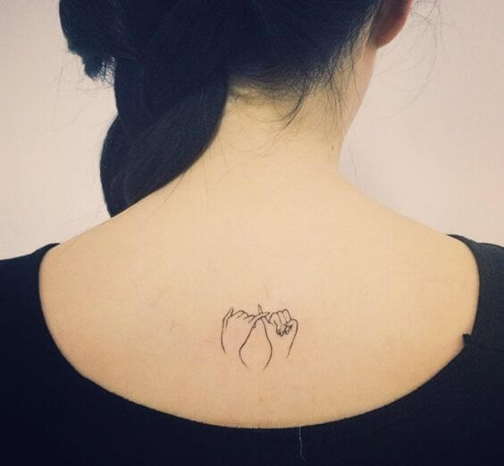 pinky promise minimal tattoo design idea on upper back for females