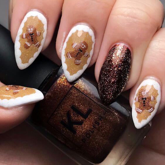 round pointy white frosting glittery golden and brow gingerbread nails art designs idea for christmas holidays 