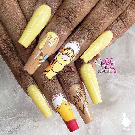 glossy nude with yellow dripped winnie the pooh nails art designs idea