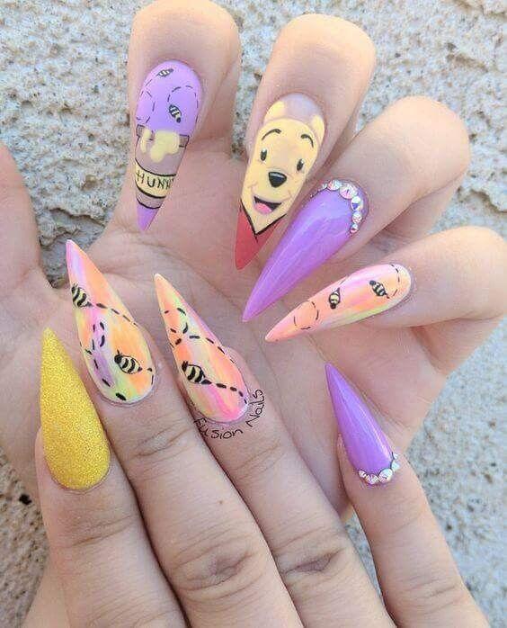 pointy purple and yellow winnie the pooh nails art designs idea