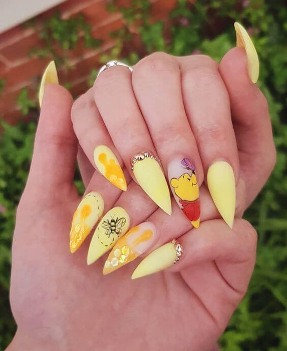 pointy yellow butterfly and winnie the pooh nails art designs idea