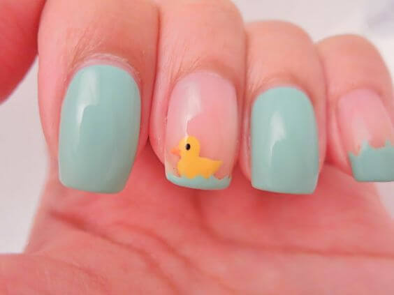 swimming yellow duck with nude and blue spring break nail art design idea