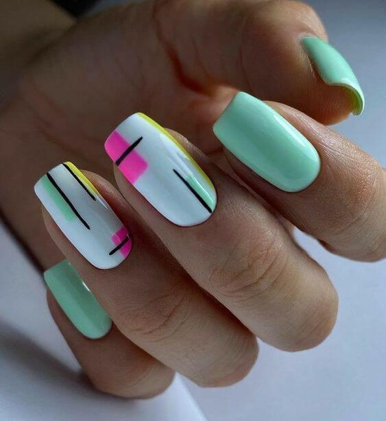 mint green with black graphic lines spring break nail art design idea