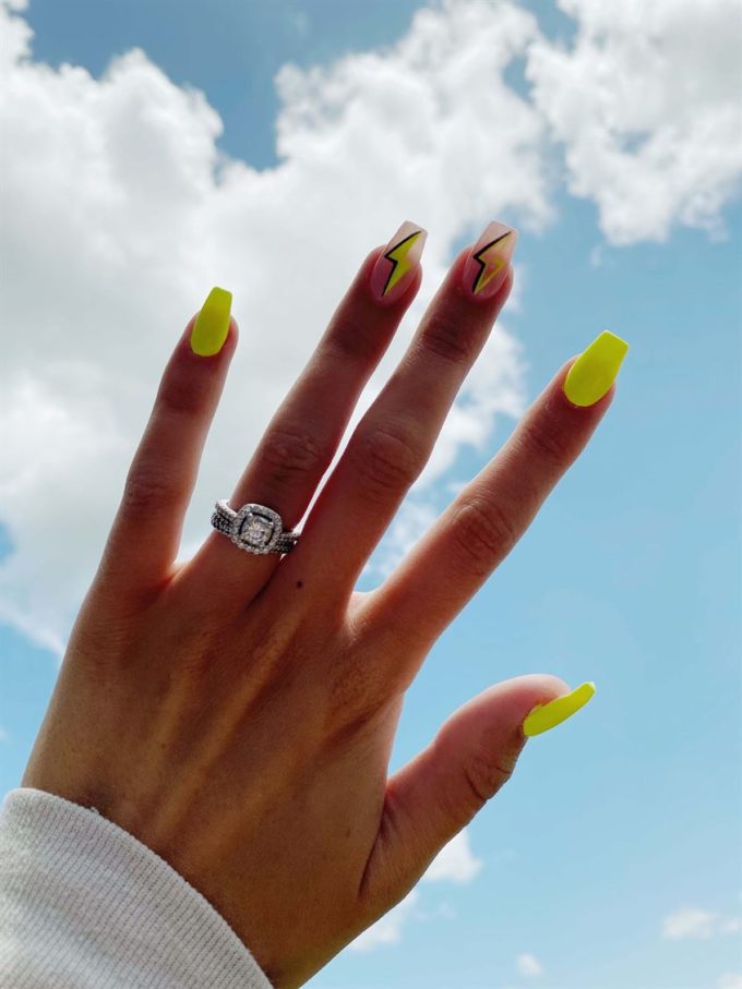 highlighter neon yellow and nude with thunder bolt spring break nail art design idea
