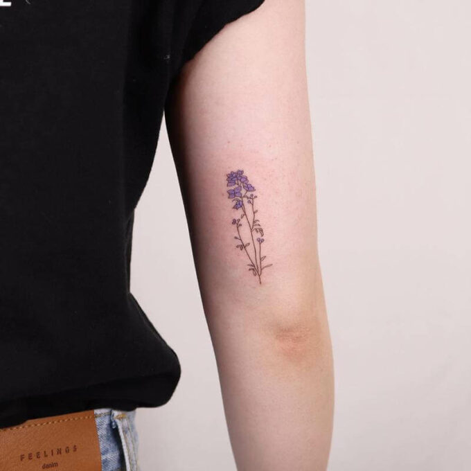 small behind arm july birth flower larkspur tattoo design idea