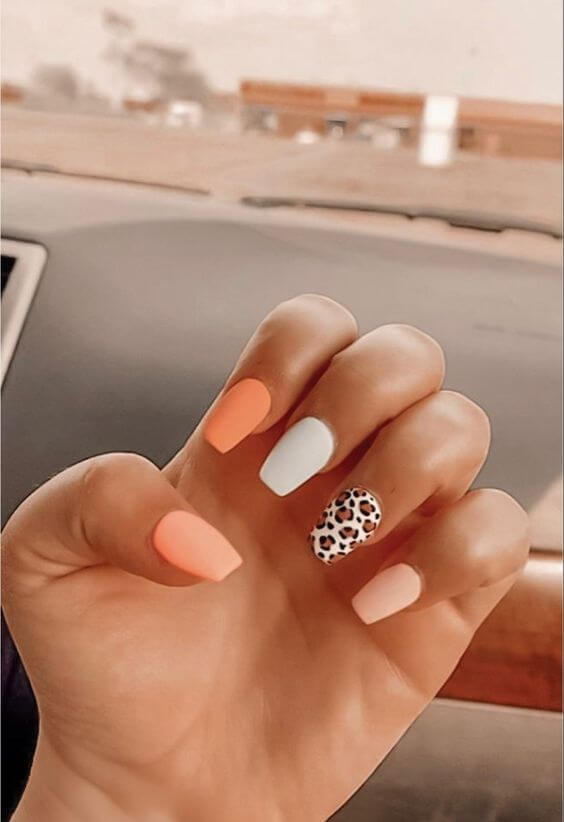 orange and white with cheetah print nail art design idea