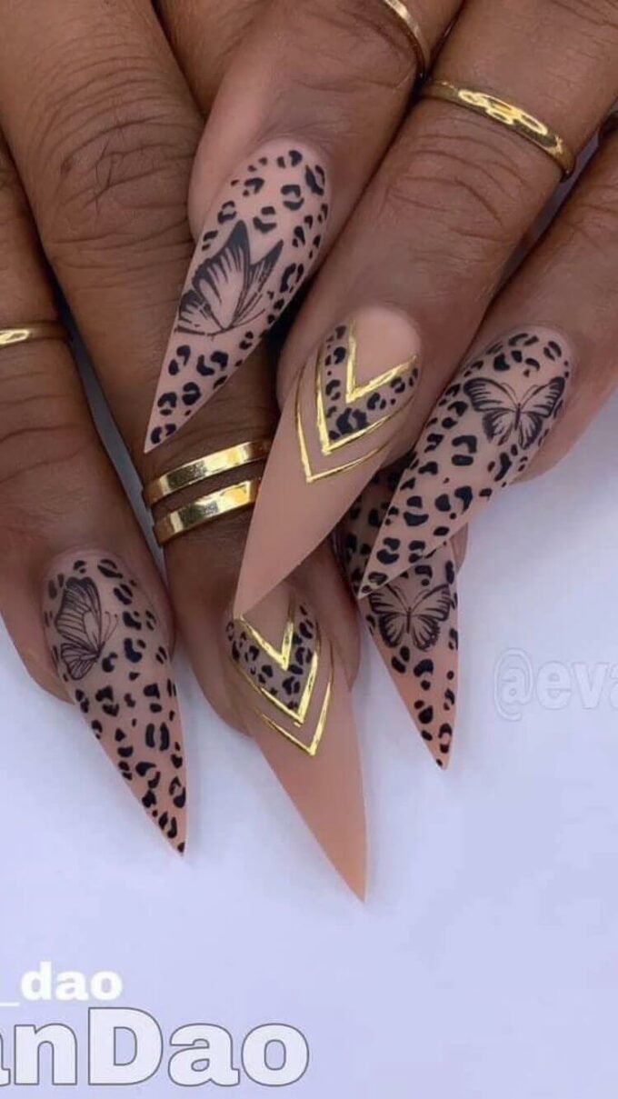stiletto nude with butterfly and cheetah print nails art designs idea