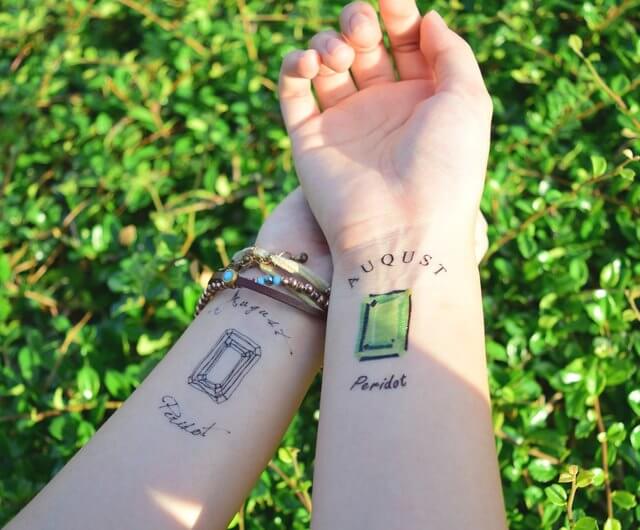 august birthstone peridot tattoo design idea