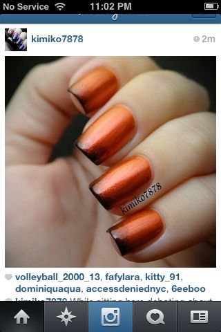 gradient black tip with metallic orange nail art design idea