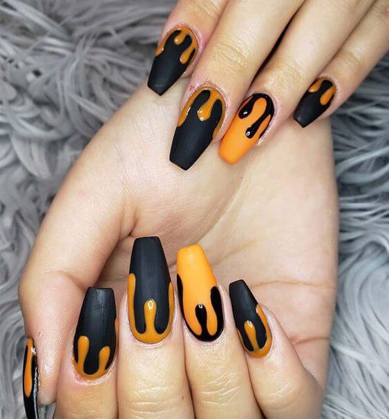 dripping art black and orange nails designs