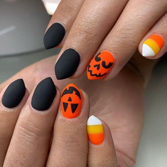 black and orange with pumpkin and candy corn halloween nails art designs idea