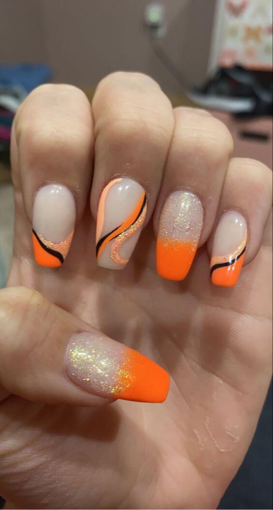 wavy black and orange nail art design idea