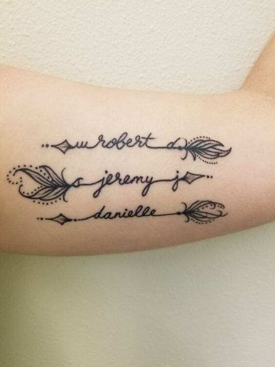 arrows with children's name tattoo designs