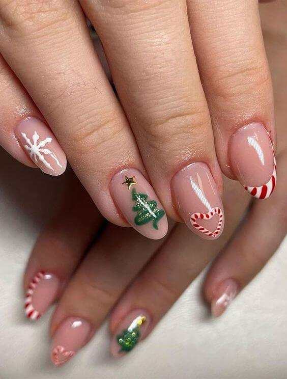 Christmas tree with snowflakes and candy cane nails art designs