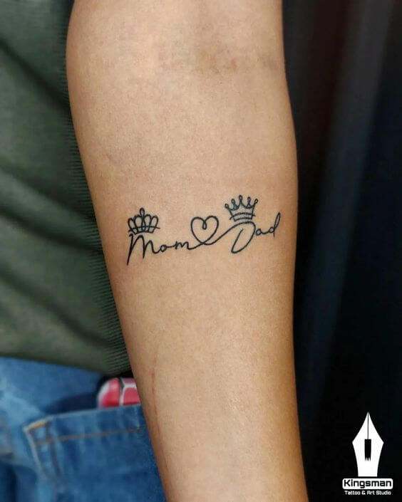 king and queen crown with heart design mom and dad tattoo on forearm