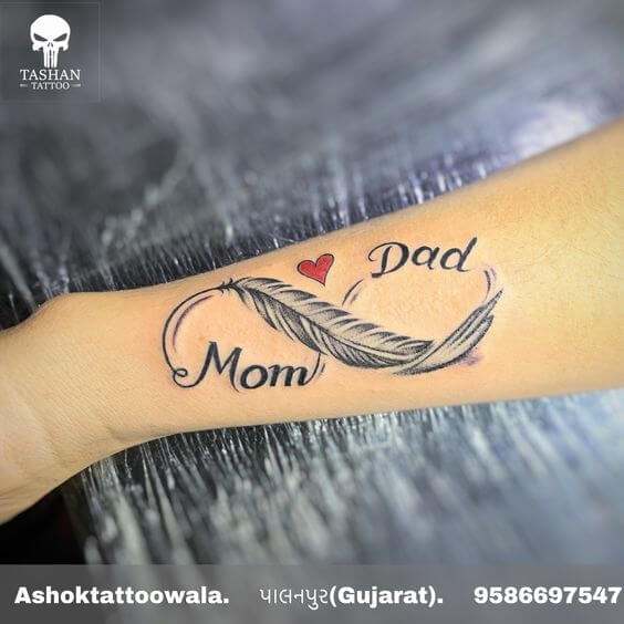 feather and heart with mom and dad tattoo design