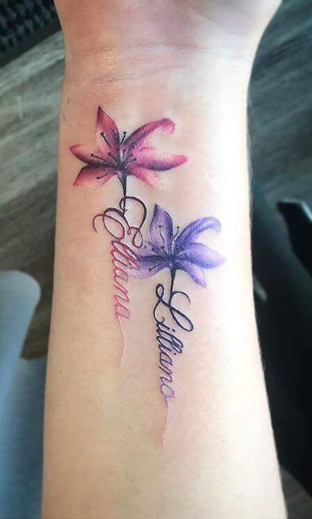 watercolor flowers with children names signature tattoo design on wrist