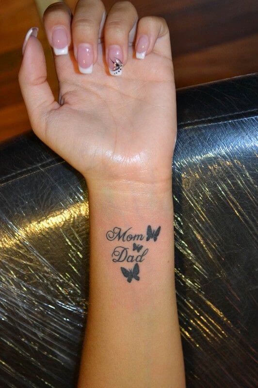 butterflies with mom dad design tattoo on wrist