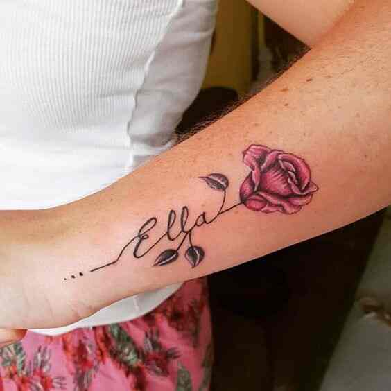 rose flower with signature child name tattoo design on side wrist