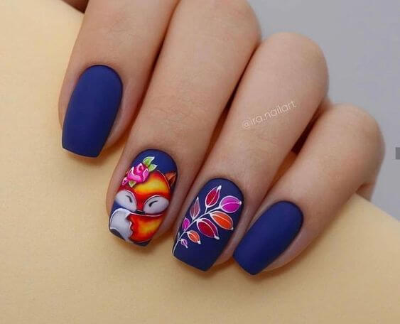 dark blue with leaves and fox nail art design