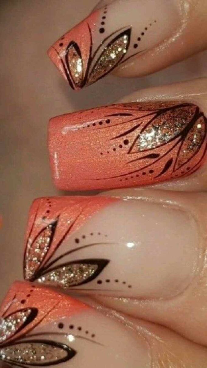glitter floral on orange fancy nail art design