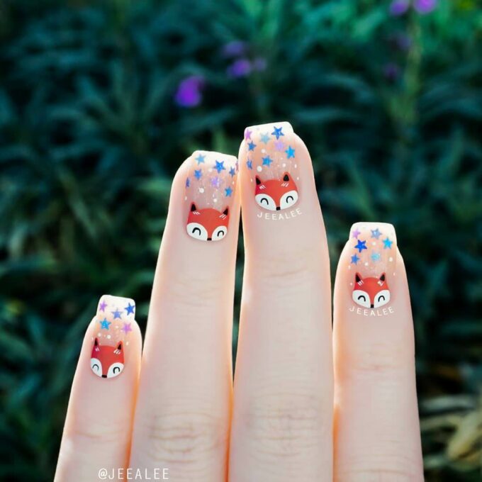 nude with stars and fox nail art design