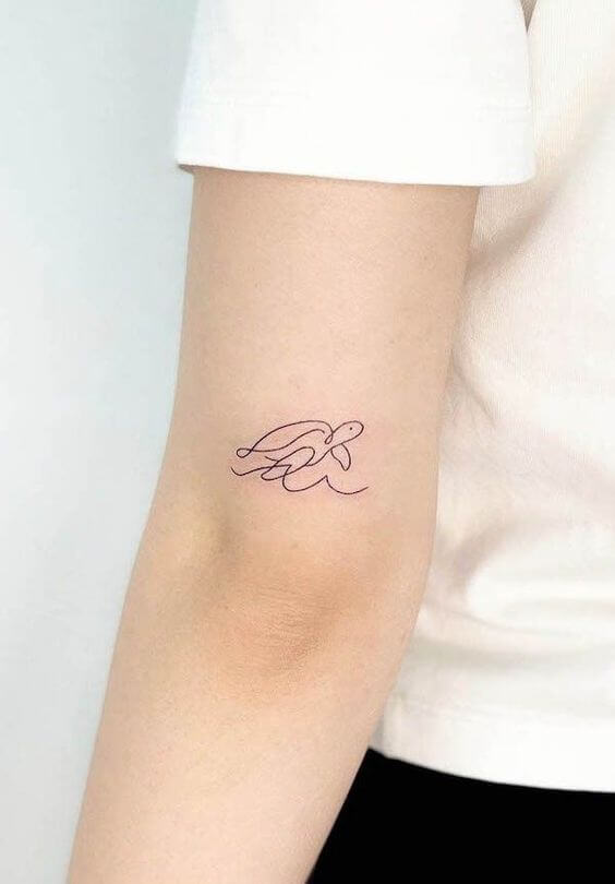 sea waves with swimming small turtle tattoo design on back arm
