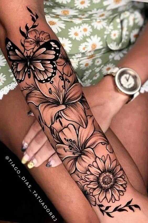 lilies with sunflowers and butterfly forearm tattoo design for women