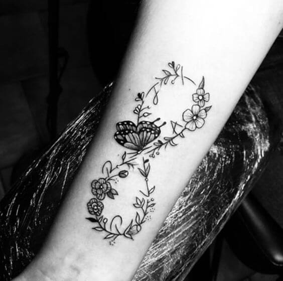 floral infinity with butterfly and grandchildren name initials tattoo design