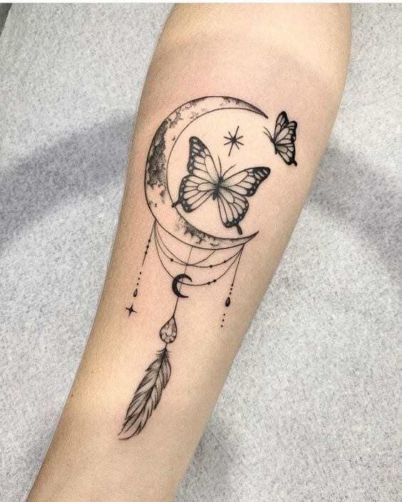 moon with stars and butterfly forearm tattoo design for women
