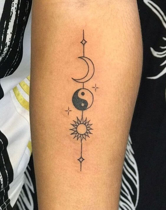 moon yin yang and sun forearm tattoo design for women