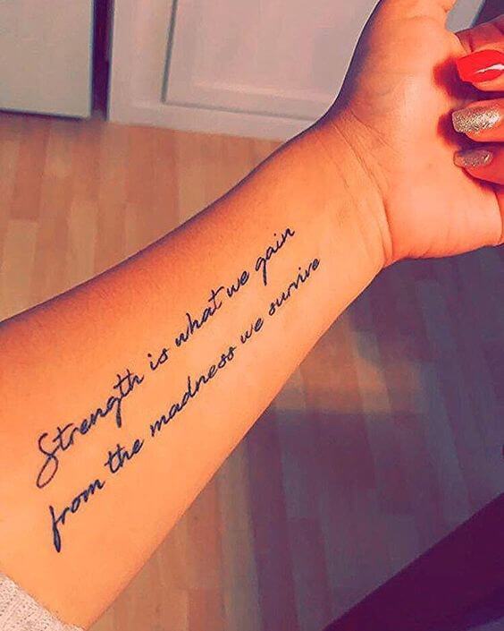 motivational strength quote forearm tattoo for women