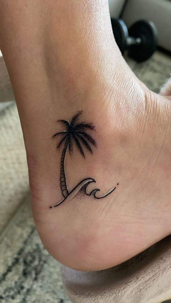 palm tree and sea wave summer girly foot tattoo design